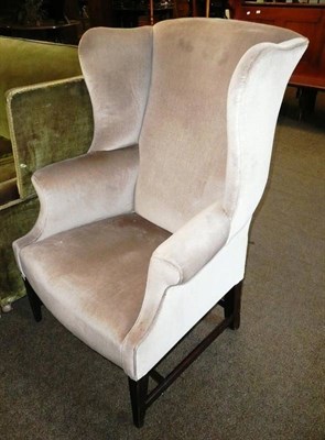 Lot 638 - Green wing back armchair