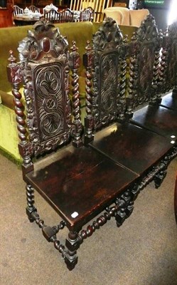 Lot 640 - A set of six carved oak high back dining chairs with barley twist supports