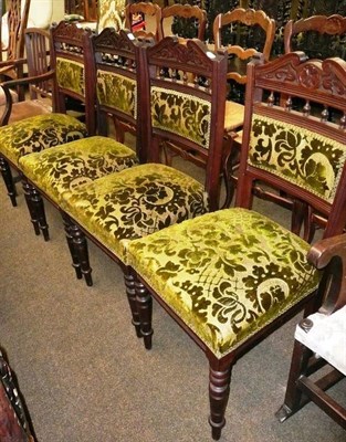 Lot 645 - Set of four late Victorian carved dining chairs with velvet seat and back