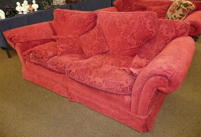 Lot 660 - A large modern Duresta three seater settee upholstered in red self-patterned chenille and cushions