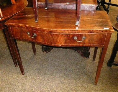 Lot 672 - George III mahogany serpentine table