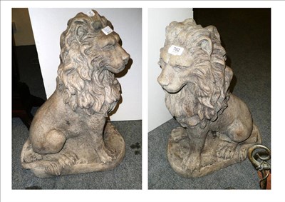 Lot 782 - Pair of cast seated lions