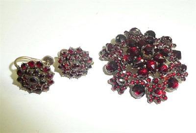 Lot 14 - Garnet set brooch/pendant and pair of similar earrings stamped '935'