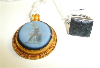 Lot 16 - An early intaglio hardstone seal reworked as a gold pendant and a similar ring