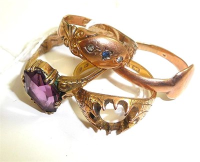 Lot 19 - A 22ct gold ring (stone missing) and three dress rings