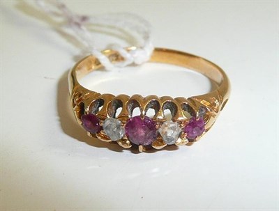 Lot 34 - An 18ct gold ruby and diamond five stone ring