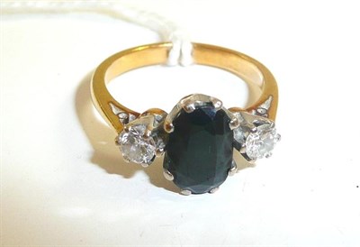 Lot 35 - A sapphire and diamond three stone ring