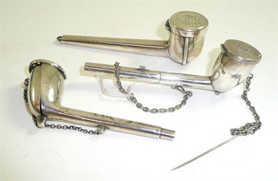 Lot 38 - Three white metal pipe holders, each engraved with an armorial device