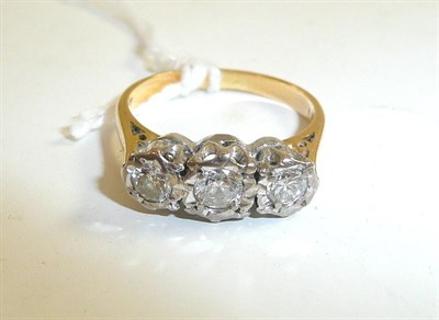 Lot 45 - A graduated diamond three stone ring, stamped '18ct'