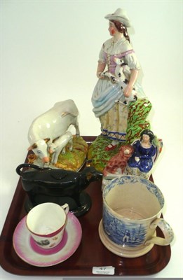 Lot 47 - Three Staffordshire figures, cow creamer, blue and white mug and a Kirby Stephen cup and saucer