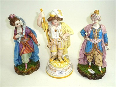 Lot 109 - A pair of French figures and another (3)