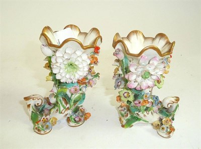 Lot 123 - A pair of English bone china, flower encrusted, cornucopia picked out in colours, 10cm