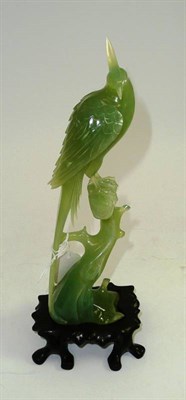 Lot 125 - A Chinese Bowenite figure of a phoenix, boxed, with wood stand