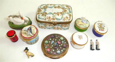 Lot 129 - Seven enamel boxes, a powder compact and three miniature figures