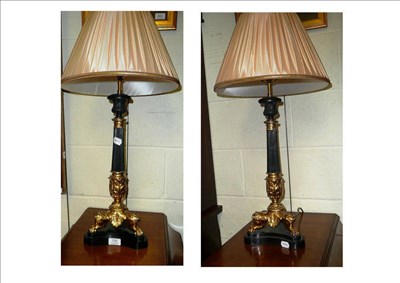 Lot 135 - A pair of reproduction Regency style table lamps