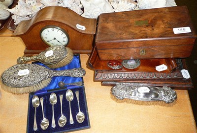 Lot 148 - Three silver backed brushes, two carved oak racks, a writing box, a mantel clock, two brooches...