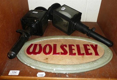 Lot 154 - Pair of carriage lamps and an oval plaster ";Wolsley"; advertising sign (3)