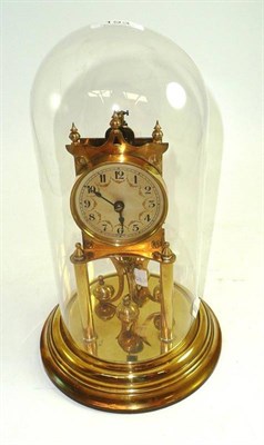 Lot 193 - A brass Anniversary clock under a glass dome