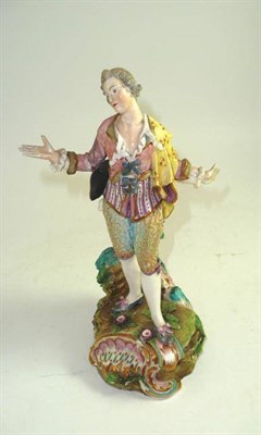 Lot 205 - An English figure after a Meissen original of a gallant with tricorn hat, depicted with arms...