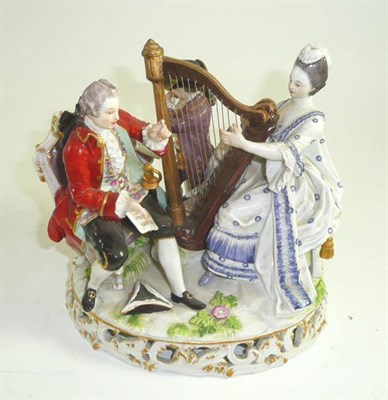 Lot 207 - A late 19th century Dresden porcelain figure group allegorical of music with three figures and...