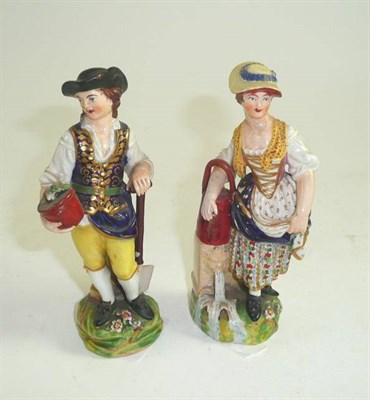 Lot 214 - Two early 19th century Derby figures of a gardener and his wife, Bloor period, on grassy...