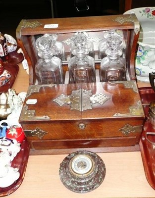 Lot 222 - An Edwardian oak tantalus with plated mounts, a barometer with marble mount and an Edwardian...