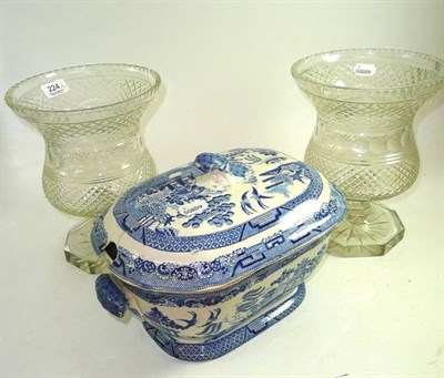 Lot 224 - Pair of cut glass pedestal vases and a willow pattern pottery tureen and cover (3)