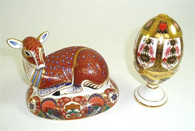 Lot 235 - Royal Crown Derby Imari decorated doe figure and an Imari egg paperweight on stand (2)