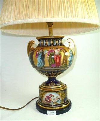 Lot 240 - A Vienna style porcelain table lamp decorated with classical figures