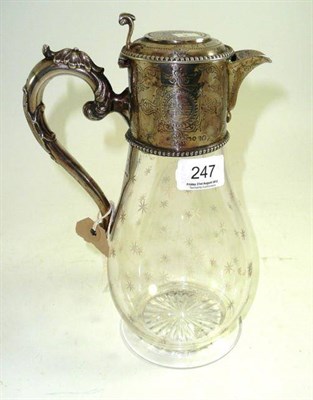 Lot 247 - A cut glass claret jug with silver mounts