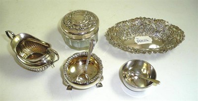 Lot 256 - A pierced silver pin dish, three silver salts and a silver topped glass hair jar