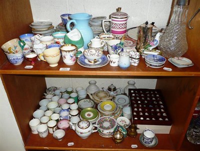 Lot 262 - Two shelves of assorted decorative and ornamental ceramics including thimbles, tea ware etc