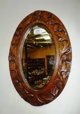 Lot 276 - Carved oak oval wall mirror dated 1909