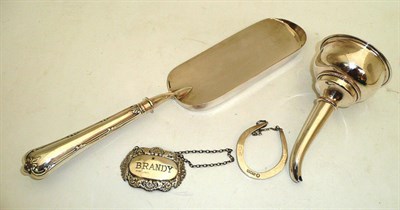 Lot 280 - A box of assorted brass wares, including a plated wine funnel, a plated crumb scoop, a silver...