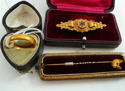 Lot 303 - A 22ct gold (1894) band ring, a brooch (missing pin) and a fox head pin