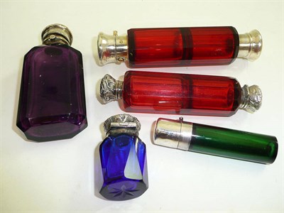 Lot 314 - Two cranberry glass double ended scent bottles and three silver topped glass scent bottles