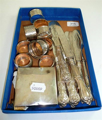 Lot 315 - Nine silver napkin rings, silver handled flatware, a cigarette box and quantity of coins