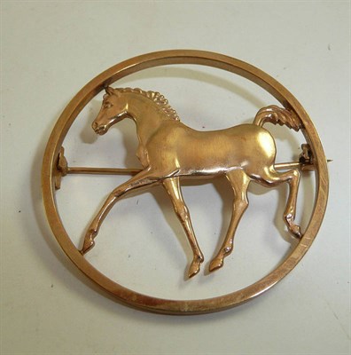 Lot 324 - A 9ct gold horse brooch