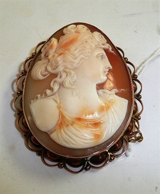 Lot 325 - A cameo brooch, circa 1900, stamped '9ct' depicting a classical portrait