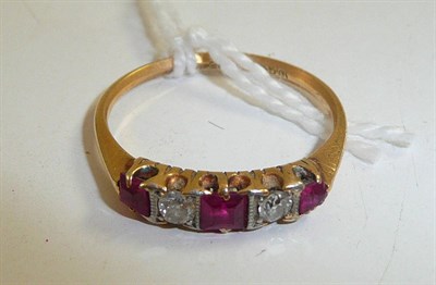 Lot 337 - A ruby and diamond five stone ring, circa 1930, stamped '18ct' (worn)