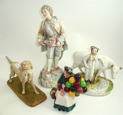 Lot 343 - A Royal Dux model of a dog, Royal Doulton figure 'Balloon Seller' HN1315, a Staffordshire group...