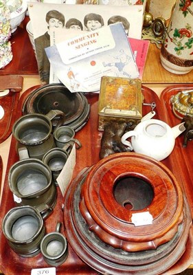 Lot 391 - An Arts & Craft brass casket, three Chinese wooden stands, a teapot and six pewter measures