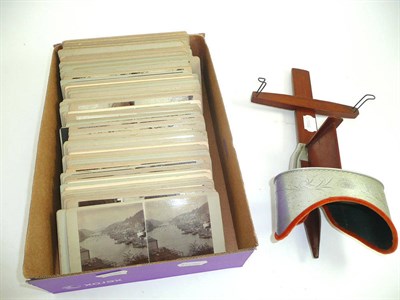 Lot 411 - A collection of real photographic stereoview cards, featuring topography and architecture,...