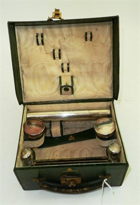 Lot 415 - Edwardian travelling dressing set with silver fittings