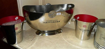 Lot 426 - A large white metal ";Taittinger"; champagne cooler and three smaller examples