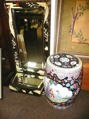 Lot 434 - A Chinese famille noir garden seat and a Chinese mirrored display stand