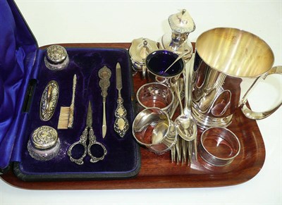 Lot 464 - A collection of assorted silver flatware, a silver Christening mug, cruet set, manicure set etc