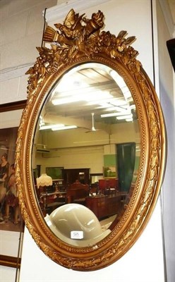 Lot 525 - Oval gilt wood wall mirror