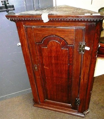 Lot 527 - George II oak corner cupboard