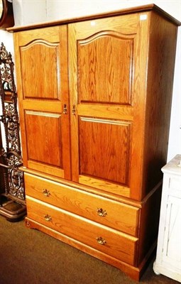 Lot 535 - A gentleman's oak double wardrobe by Royal Oak Company, Grassington